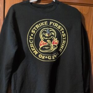 Cobra Kai Black and Yellow Sweatshirt with Vintage Cobra Design